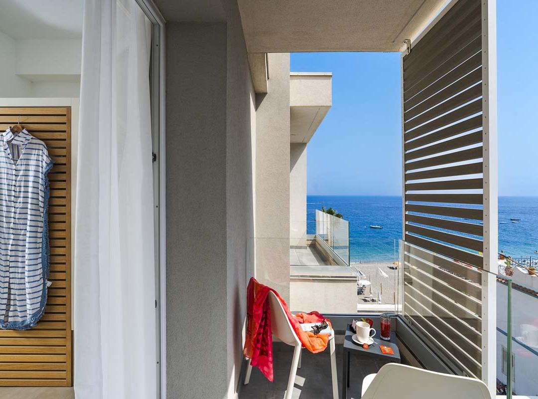Sea view from a balcony with summer breeze and relaxing atmosphere.